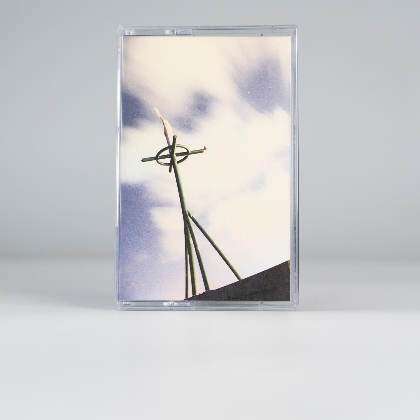 a compact cassette for the same record. same cover but no text